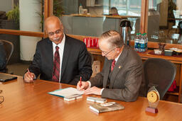 Muskegon Community College signing agreement.