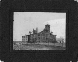 Old Main  matted photo. Before 1920.