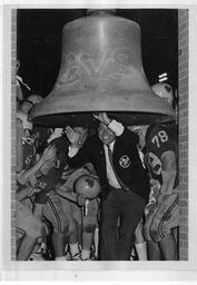 Football team ringing victory bell. 1968.