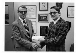 Furroughs Wellcome pharmacy donation with Dean Ovhall. 1975.