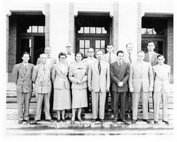 Pharmacy faculty with Dean Wilson. Alumni Building. 1950s.